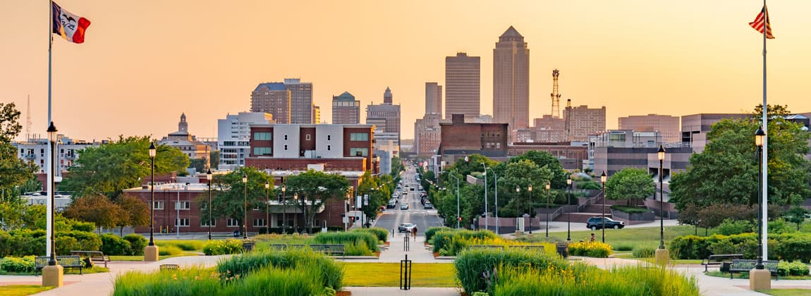 Downtown Des Moines skyline at golden hour from a city park.